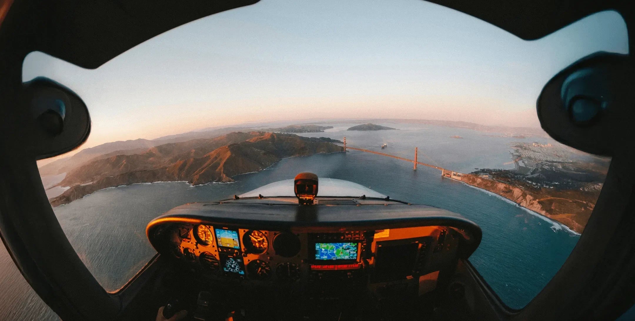 Hero background — aerial runway at sunset